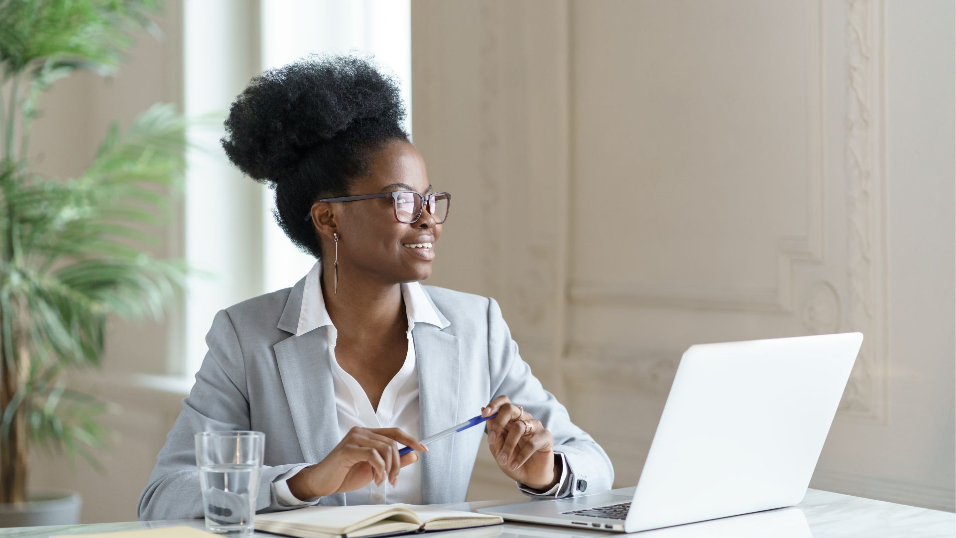 A young woman in professional attire representing a conveyancing secretary
