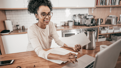 A lady studying in the kitchen to represent short courses for attorneys