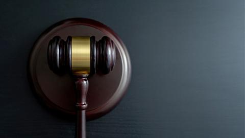 a gavel resting on its block, a common piece in any court