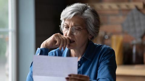 A woman reading over an eviction order