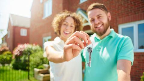 A couple who have just bought a home, unaware of the hidden costs of home ownership