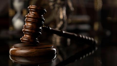 A judges gavel, often used when there is a breach of courtroom etiquette