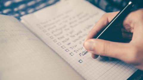 A person putting together a life file checklist to ensure they are prepared for the worst